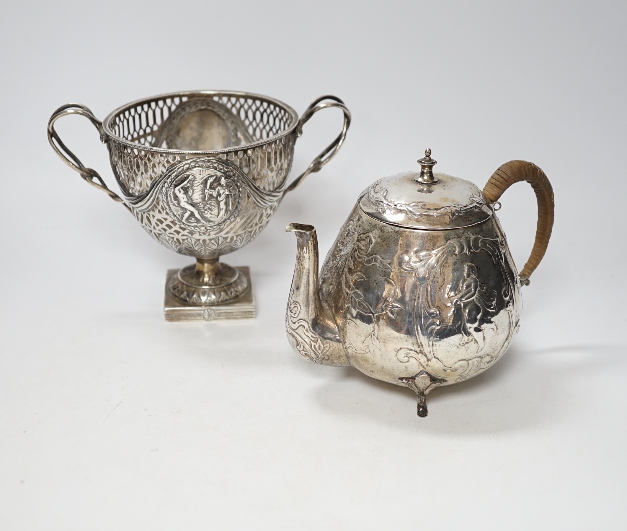 A pair of Thai circular white metal bowls, and a pair of small bowls, all decorated with animals and foliate scrolls, inscribed on bases, diameter 12cm and 8.5cm
